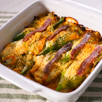 Fiori di zucca al forno, ripieni di alici, ricotta, mozzarella e zucchine